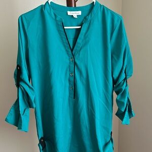 Green with black and gold accent tunic top